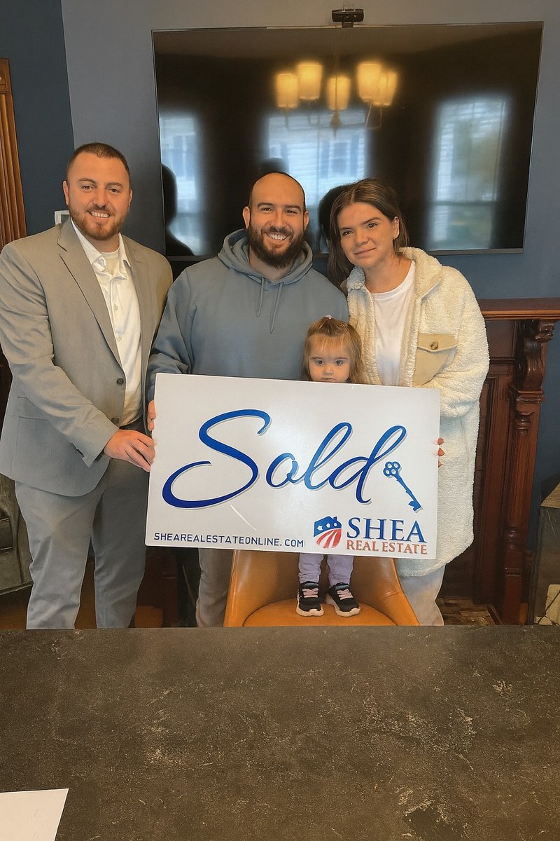 Clients celebrating real estate closing with Jared Mason